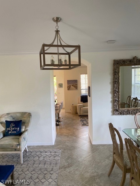 Dining area featuring crown molding, an inviting c
