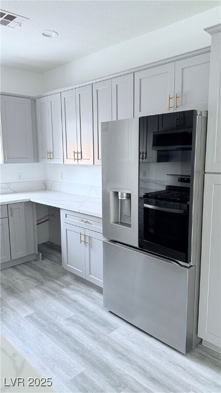 Kitchen with gas range oven, extractor fan, visibl