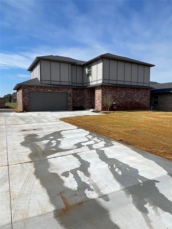 View of front of property featuring concrete drive