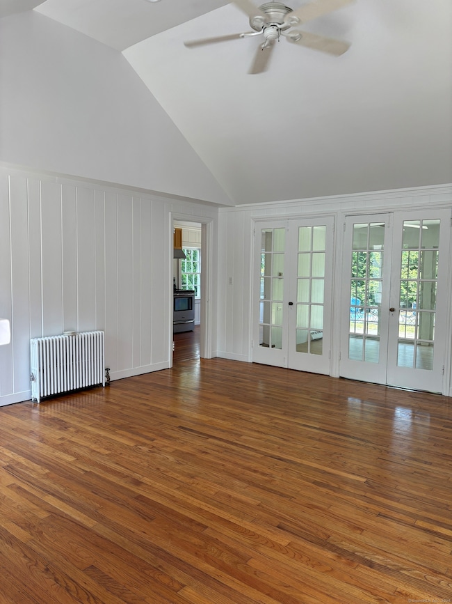 Living room with doors leading to the sun room and the kitchen