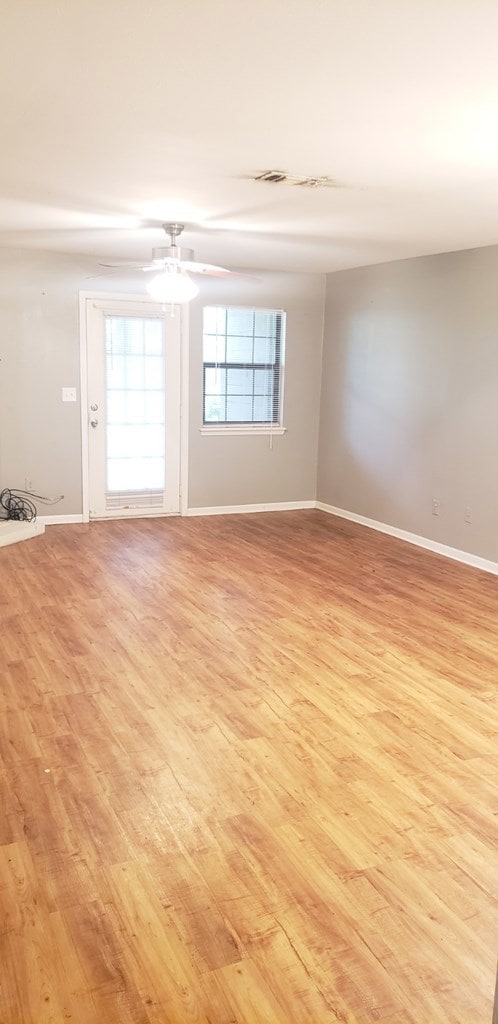 Family Room view from entrance. Door opens onto pa