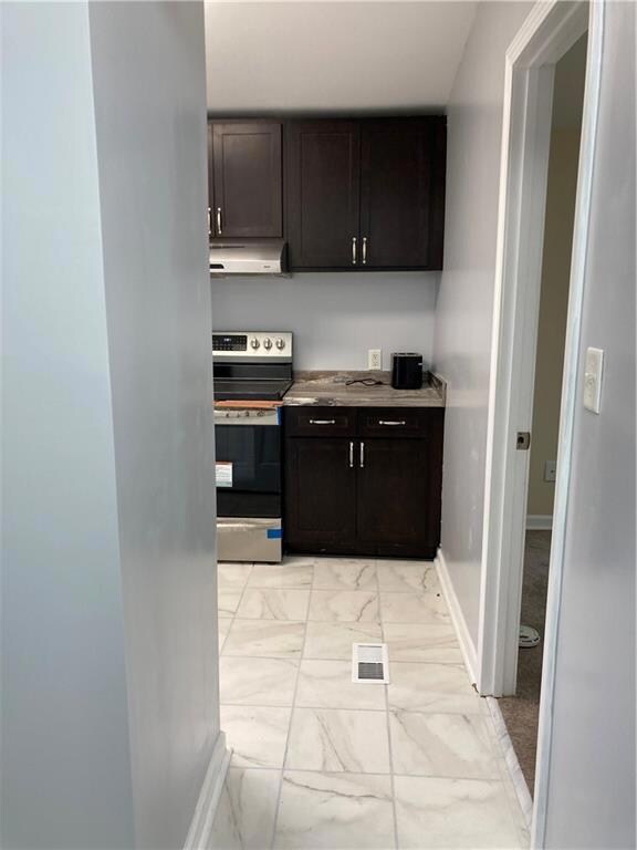 hallway from back door, laundry room to left of en