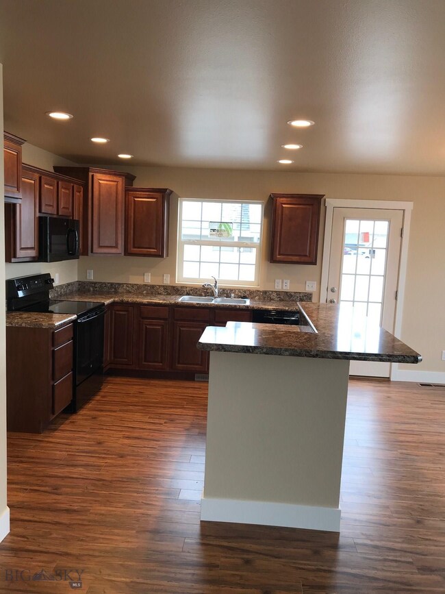 Kitchen. Photo of similar home.
