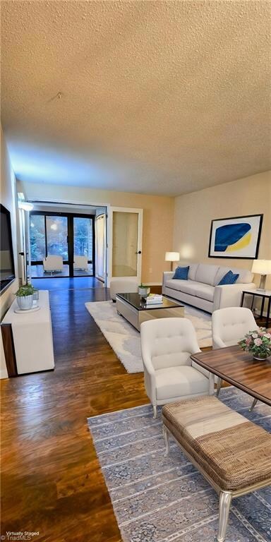 Open living room, dining room, sunroom concept - VIRTUALLY STAGED