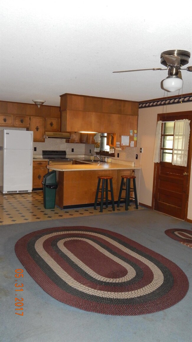 Off of the side garage entrance leads to the kitchen and dining area. 