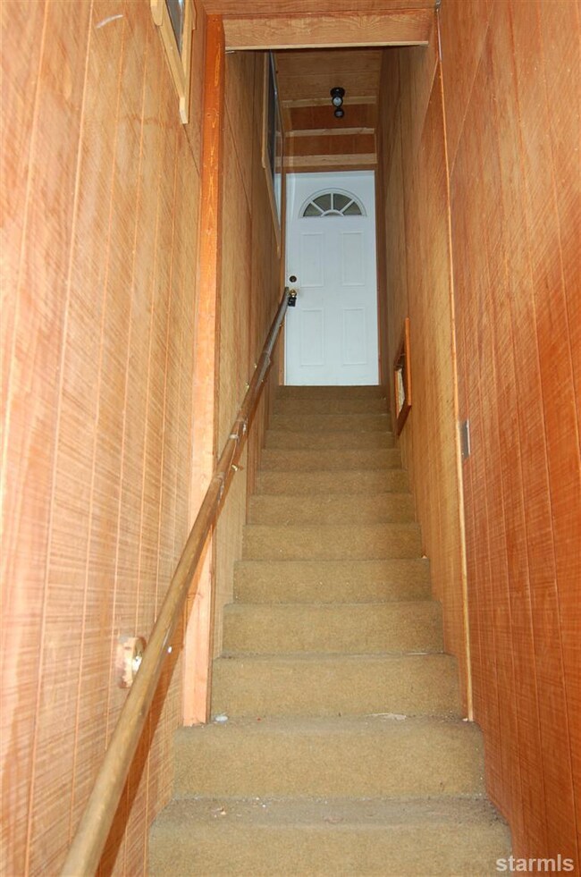 Unit 2 is accessed from side of building up covere