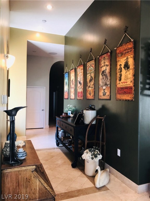 Main house entry foyer - stone floors, can lights
