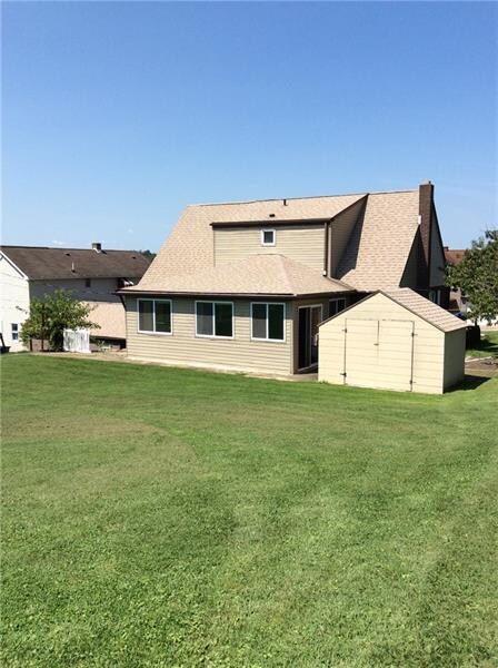 Back of the house with a large shed to store your 