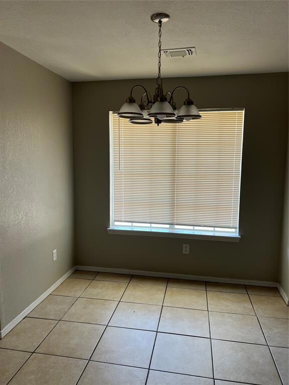 Unfurnished dining area featuring an inviting chan