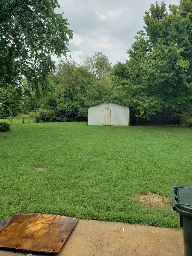 Storage in rear fenced area of yard.  Also has a covered shed area.  Lots of Play room or enjoyment for that special pet