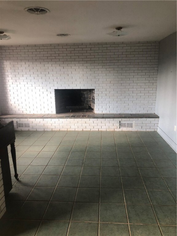 Lower level family room with stone fireplace