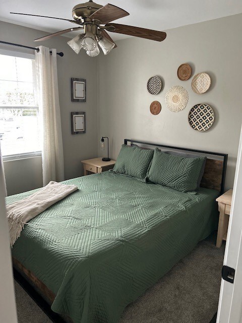 Main floor bedroom, ceiling fan, carpet
