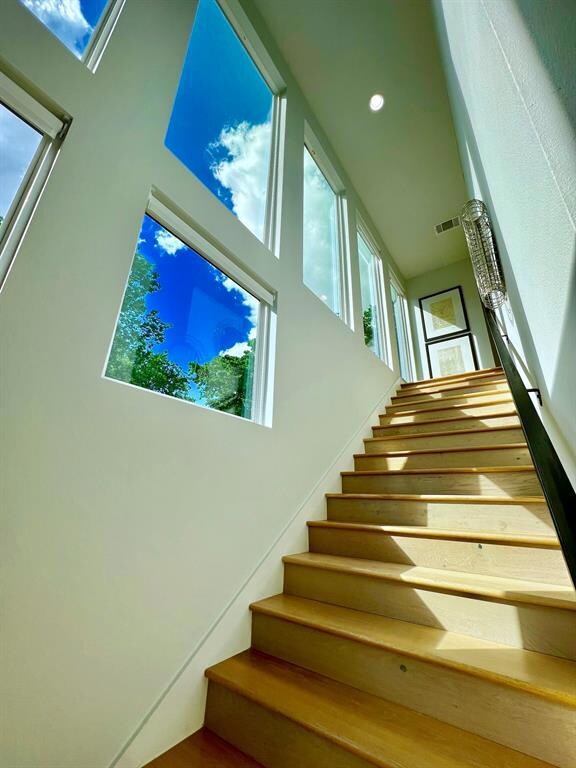 Stunning staircase and wall of windows.