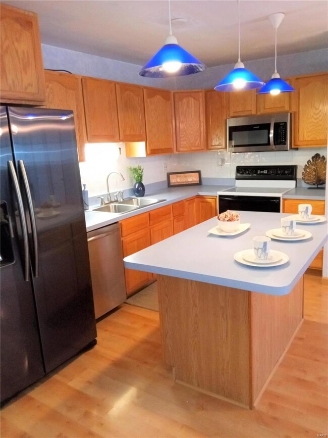 Plenty of Cabinets and Center Island with overhand