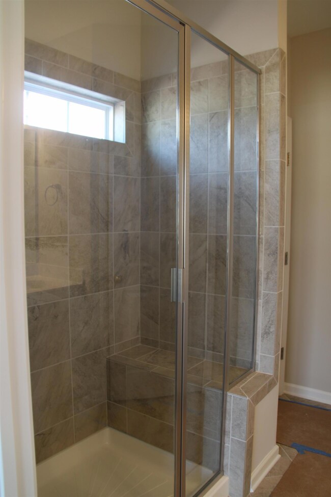 Tile master shower with a seat is included.  Similar house.