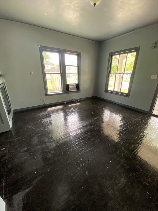 Living room with dark hardwood / wood-style floors