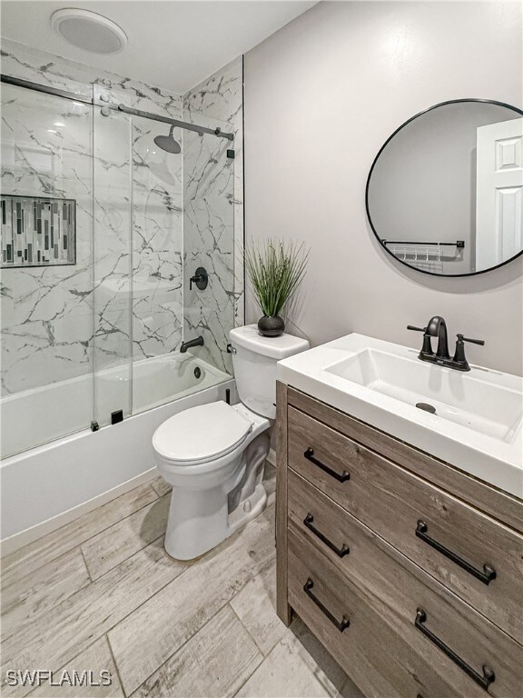 Full bathroom with vanity, enclosed tub / shower c