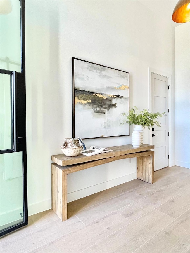 Unfurnished office with light wood-style flooring