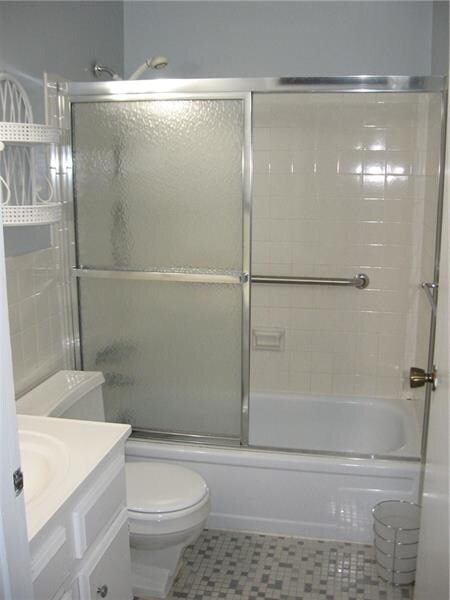 updated bath is located just outside of the bedroo