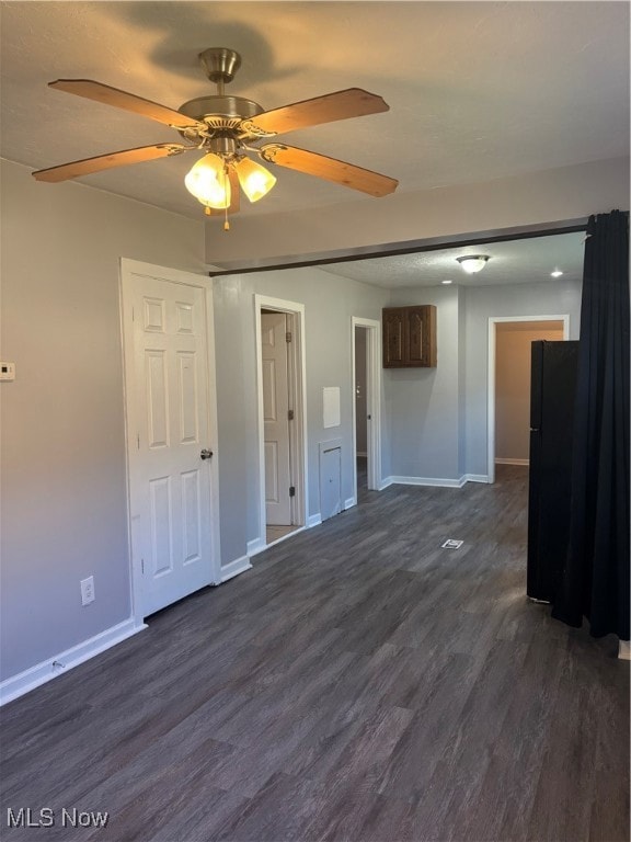Open concept floor plan featuring a ceiling fan, lights fixtures, NEW vinyl flooring, and fresh paint all throughout the home!