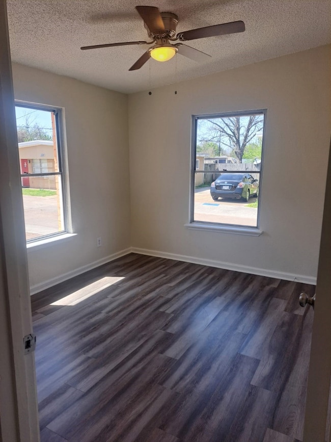 Bedroom 1 is filled with natural light, featuring