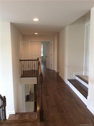 Upstairs hallway, double doors into master bedroom