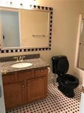 Full bathroom with vanity and light tile patterned floors
