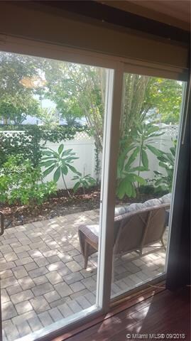 Sliding glass doors offer sumptuous indoor-outdoor