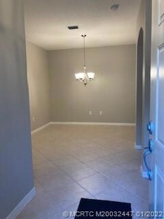 TILE FLOORS IN THE DINING ROOM.  BEAUTIFUL LIGHT FIXTURE.  CLOSE TO THE KITCHEN.