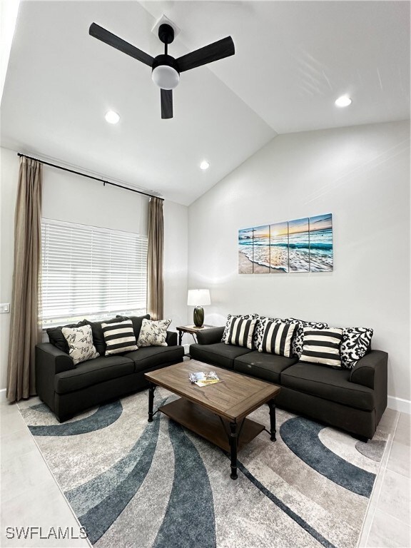 Living room with ceiling fan and vaulted ceiling