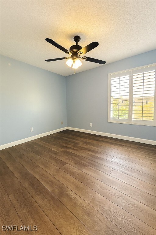 Spare room featuring LVP floors, ceiling fan, and