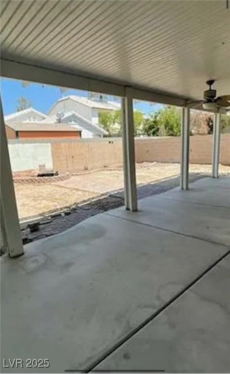 View of patio featuring ceiling fan