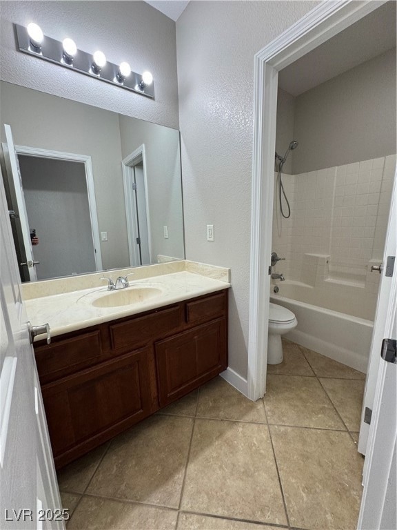 Down stairs Bathroom with a textured ceiling, toil