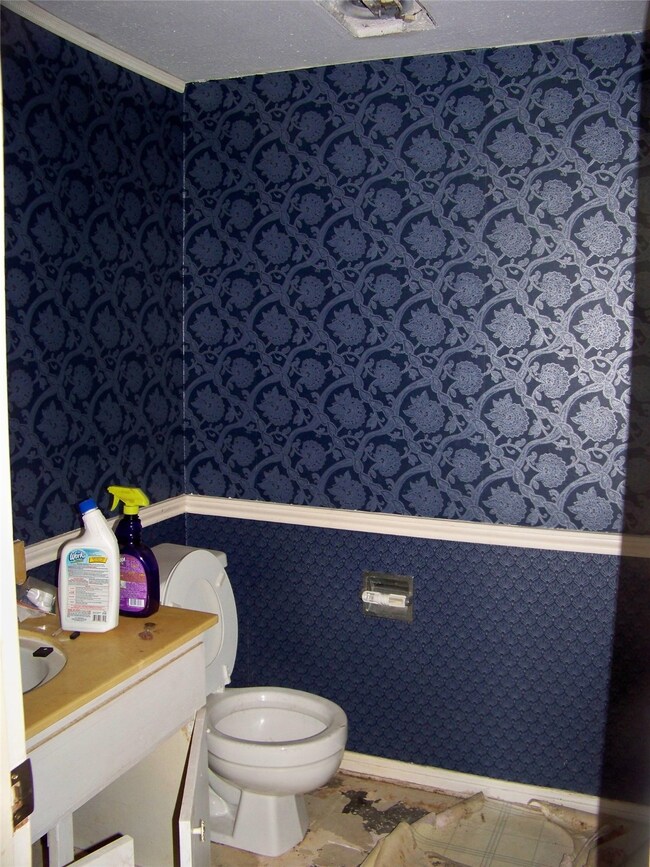 Guest bath off laundry room area.