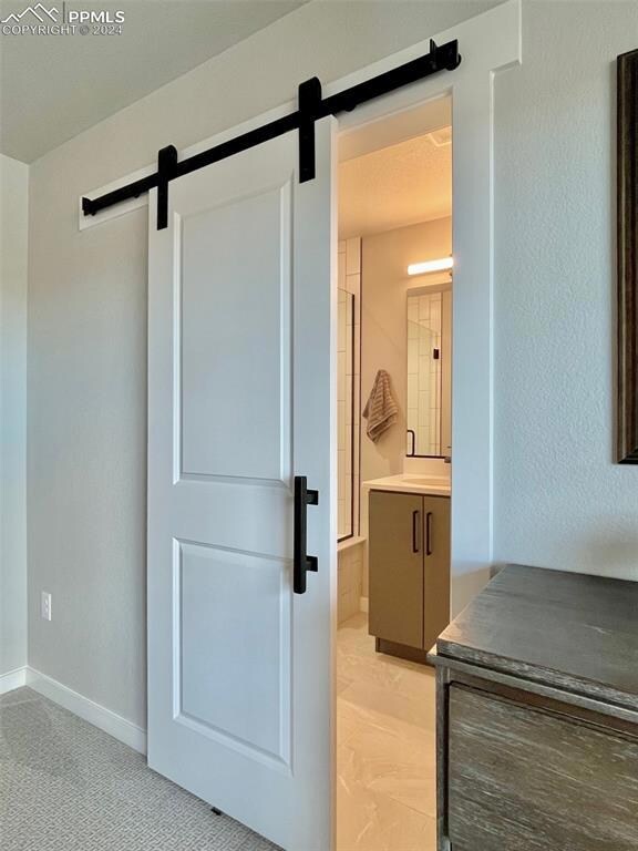 Barn door at primary bedroom