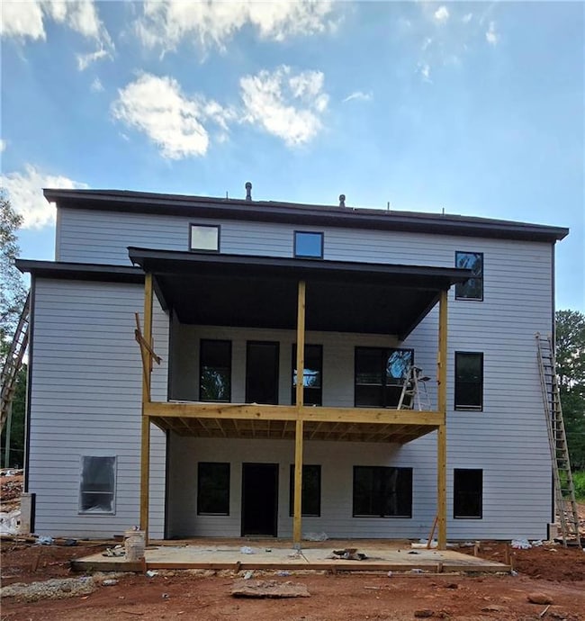 Rear view of house with a balcony