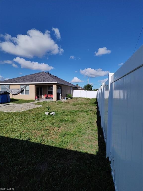 View of yard featuring a patio