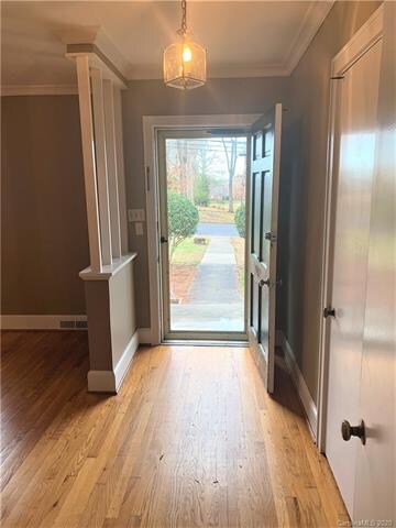 View from Hall toward Front Door - Living room to 