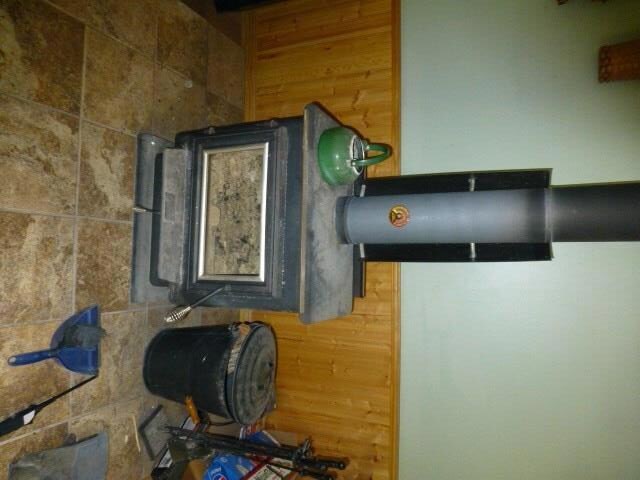 Wood stove with tile hearth keeps...