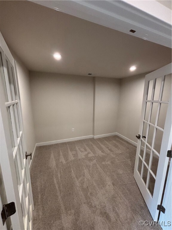 Unfurnished room with carpet flooring, recessed lighting, and french doors
