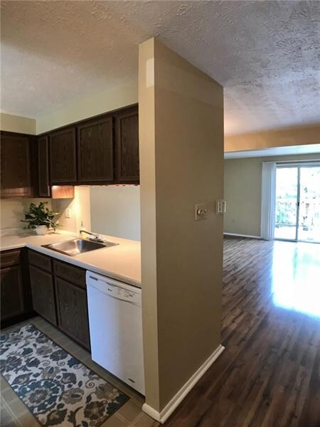 Entry into Kitchen.  Dishwasher and refrigerator l
