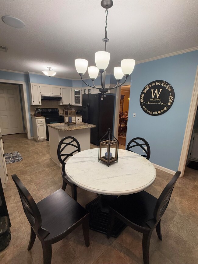 Dining room featuring a toaster, baseboards, ornam
