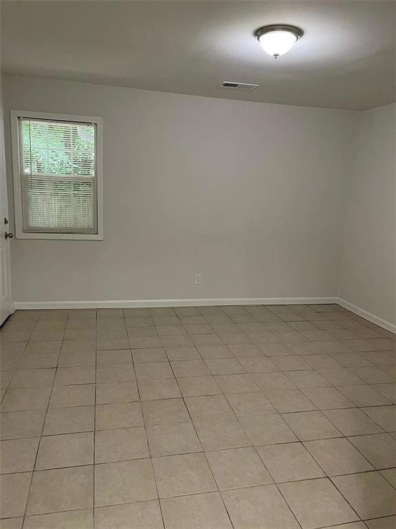 Unfurnished room featuring baseboards
