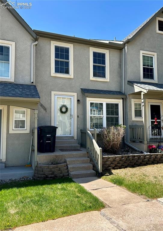 View of property featuring stucco siding