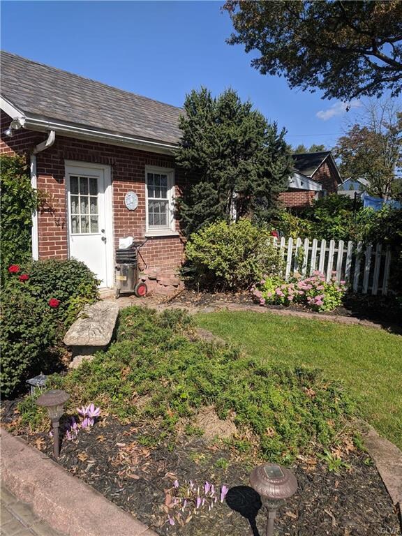 Well-tended flower beds create a welcoming outdoor