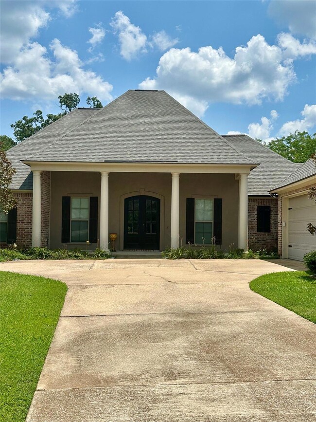 View of front of property featuring a garage
