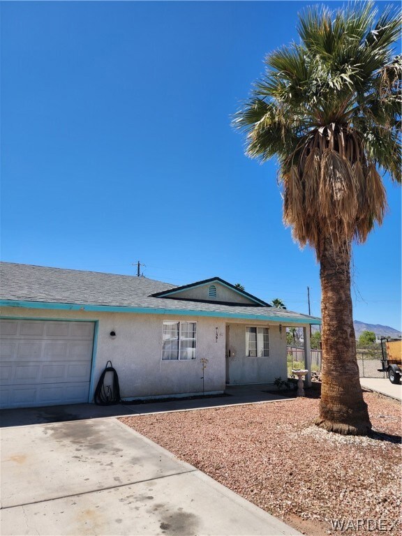 Single story home with a garage