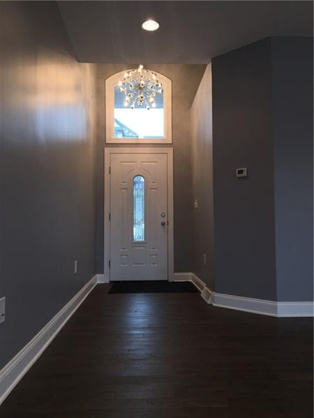The soaring 18 foot high foyer welcomes guests and leads throughout he 1st floor with hardwood floors.