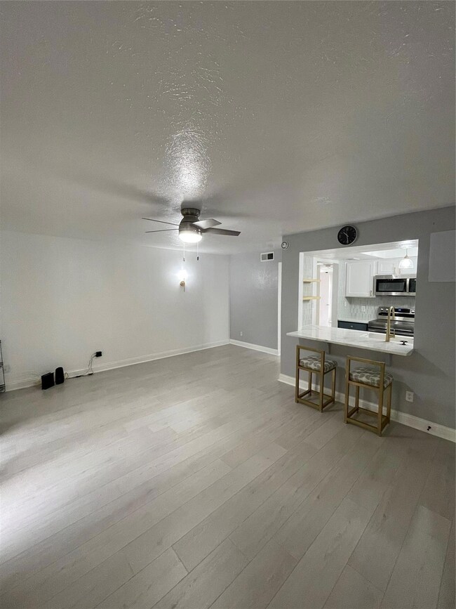 Living room featuring light hardwood / wood-style 