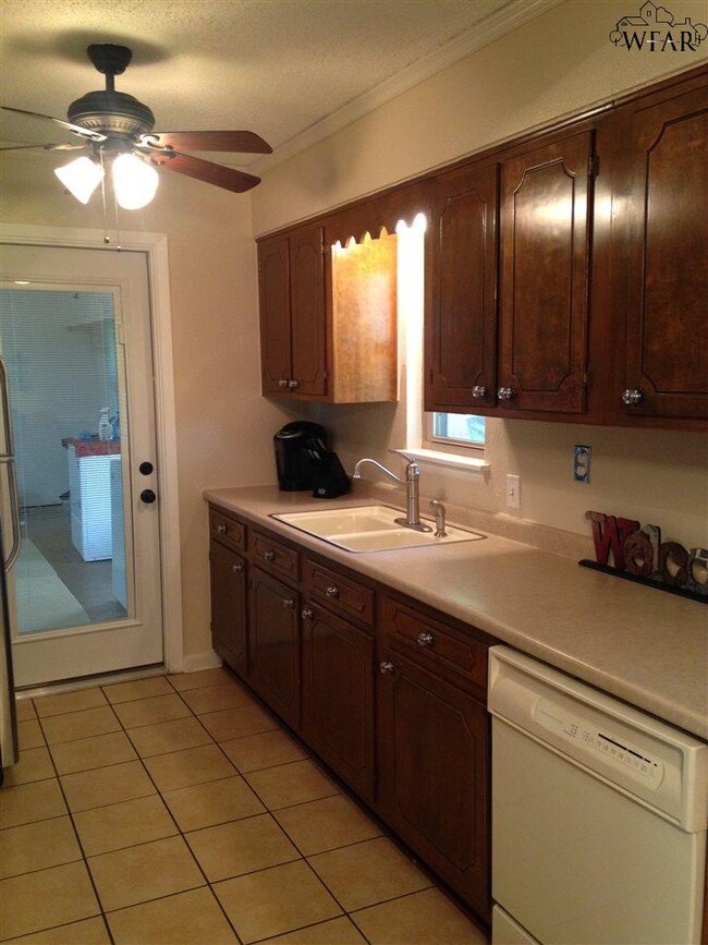 Formica counter tops, disposal, dishwasher.